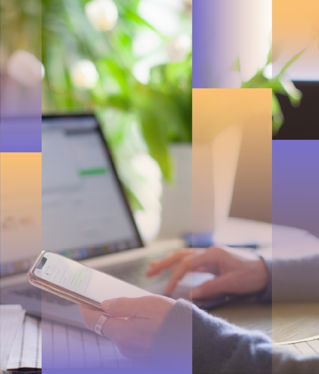 Side photo of a woman working at her laptop while holding a mobile phone.